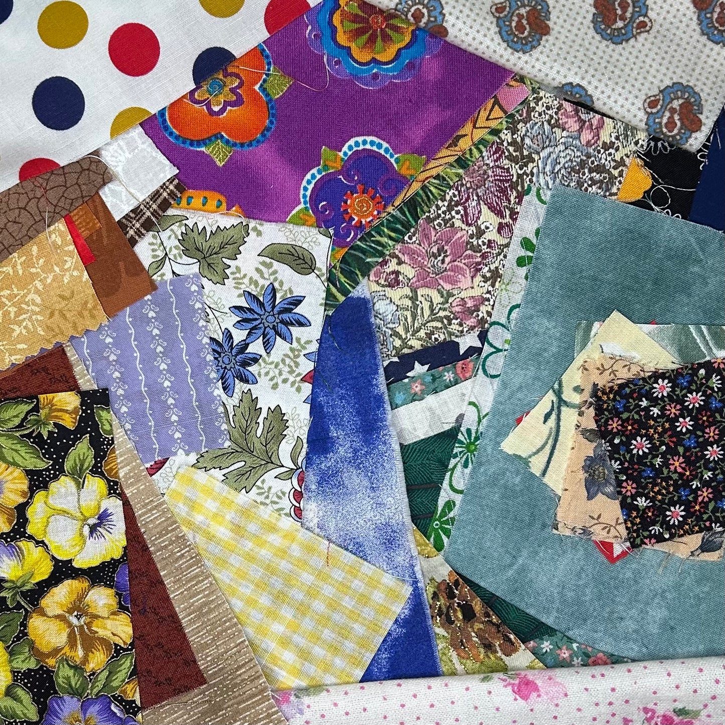 Collection of colorful quilt blocks with various patterns and colors.