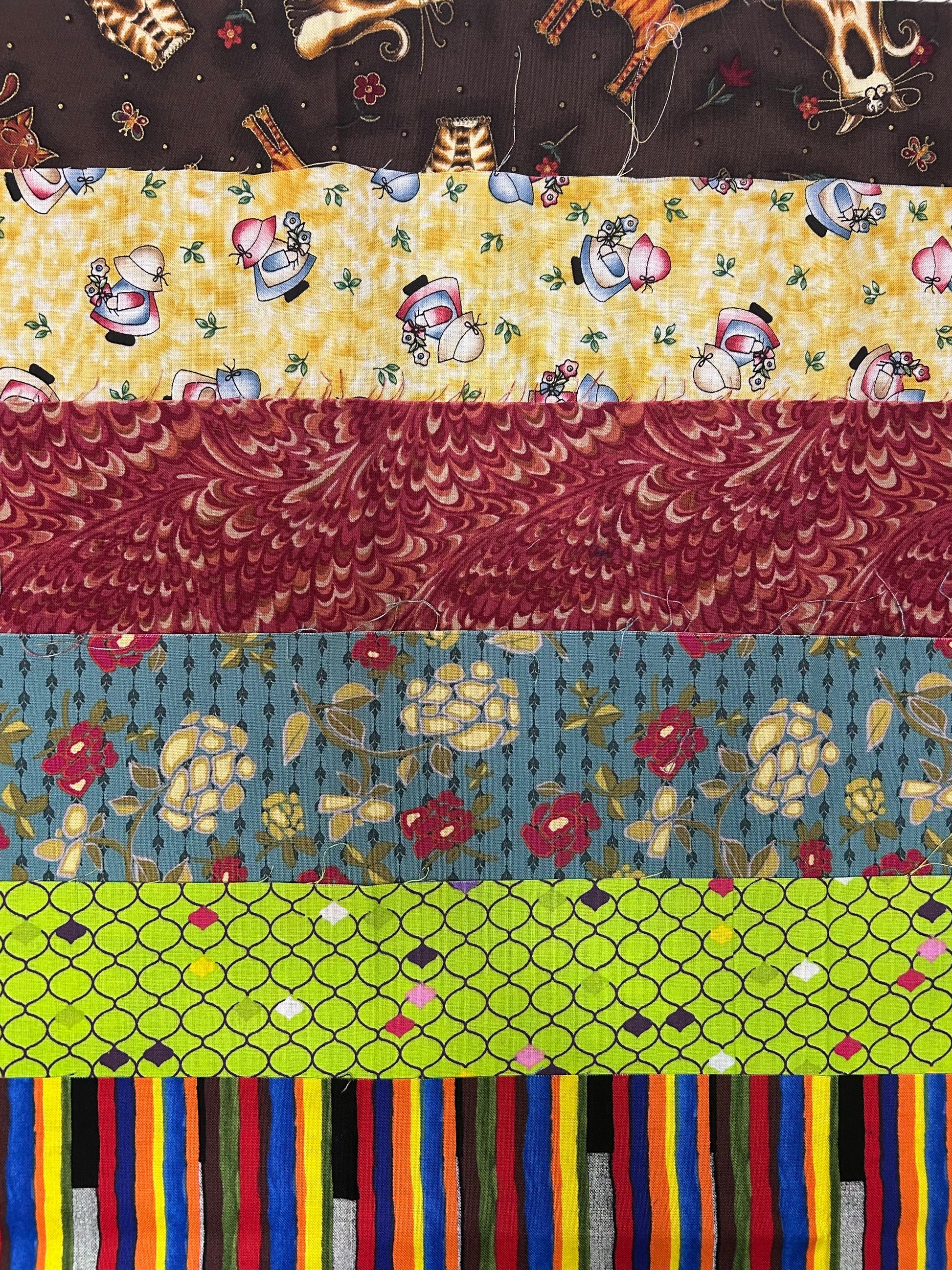 Collection of various patterned fabric strips arranged vertically subscription